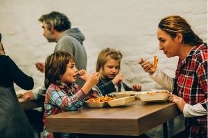 family eating takeout 300x200